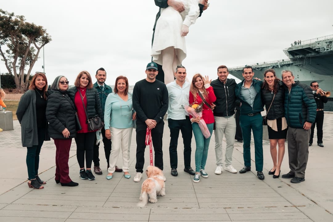 handler self-care — a group of people posing for a picture with a dog