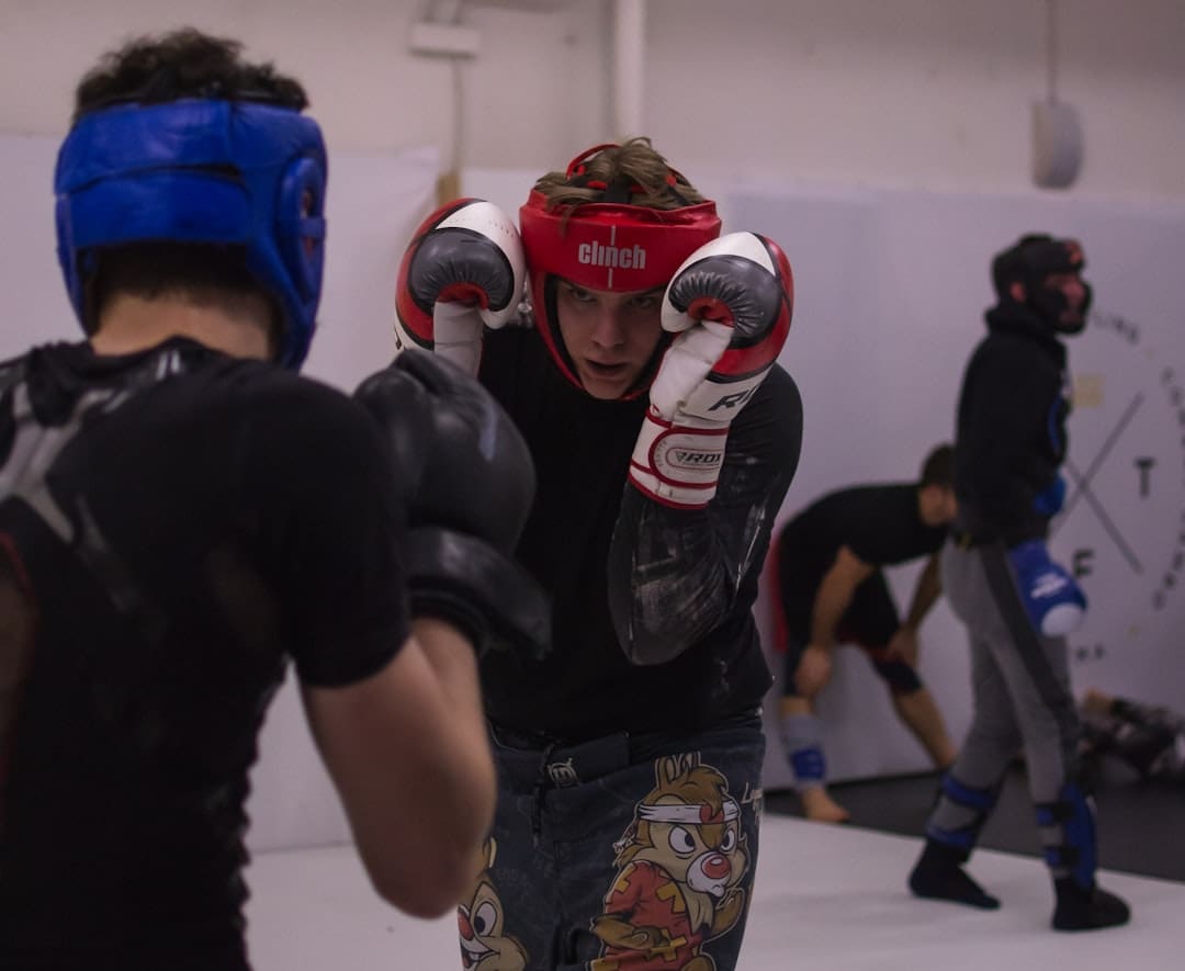 desensitization training — man in black t-shirt and black and white helmet